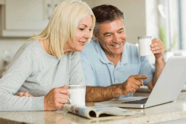 what is the best business to start now. mature couple looking at a laptop