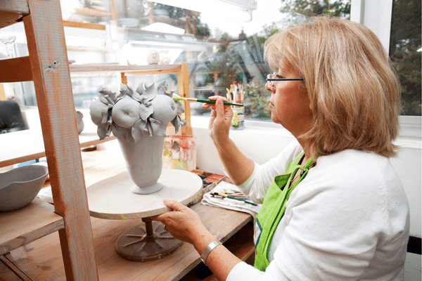 home enterprise for over 50.mature female doing craft work 